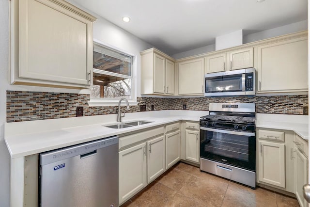 214 Crystal Knoll Blvd, Georgetown, TX 78626 - kitchen with stainless steel appliances, cream cabinets, tasteful backsplash, and light countertops