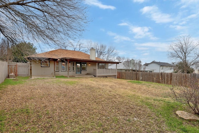 214 Crystal Knoll Blvd, Georgetown, TX 78626 - rear view of house with a chimney and a fenced backyard