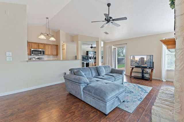 198 Prairie Springs Loop, Georgetown, TX 78626 - living area with baseboards, vaulted ceiling, dark wood-style floors, and ceiling fan