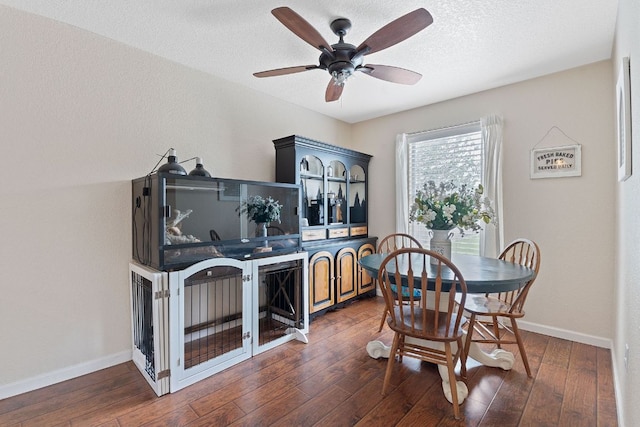 198 Prairie Springs Loop, Georgetown, TX 78626 - dining area with dark wood finished floors, baseboards, and ceiling fan