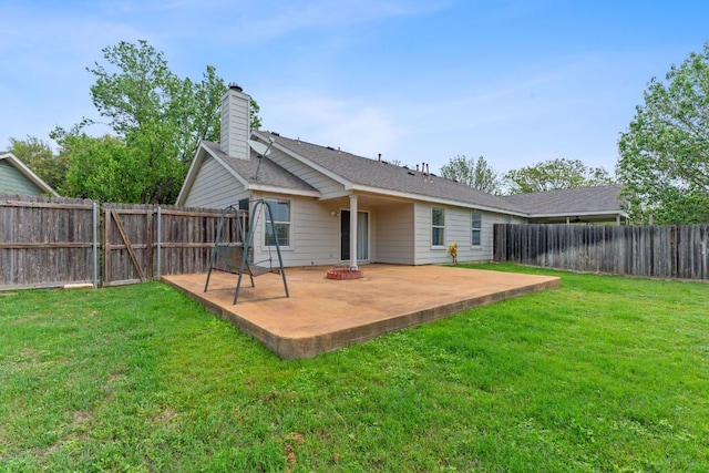 198 Prairie Springs Loop, Georgetown, TX 78626 - rear view of house featuring a fenced backyard, a chimney, a yard, and a patio