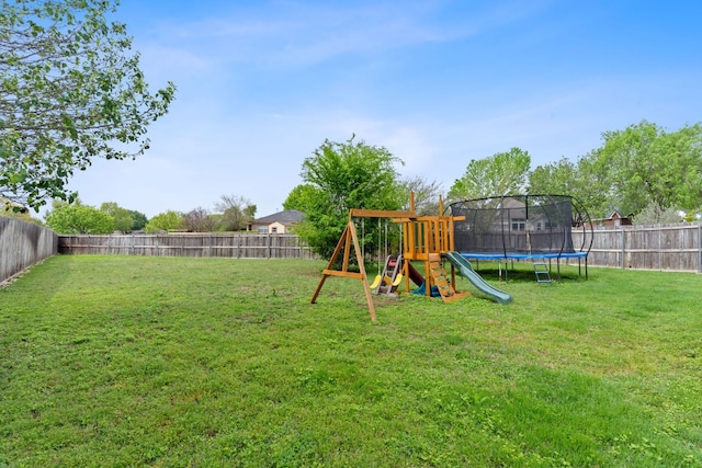 198 Prairie Springs Loop, Georgetown, TX 78626 - view of yard with a fenced backyard, a playground, and a trampoline