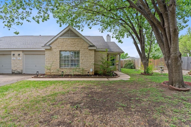 198 Prairie Springs Loop, Georgetown, TX 78626 - single story home with a chimney, driveway, stone siding, an attached garage, and fence