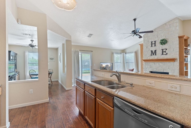 198 Prairie Springs Loop, Georgetown, TX 78626 - kitchen with ceiling fan, stainless steel dishwasher, a sink, and brown cabinets