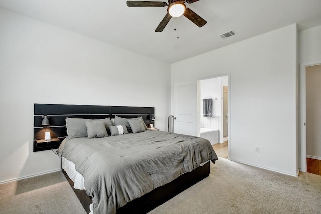 118 Esparza Dr, Bastrop, TX 78602 - bedroom featuring light colored carpet, ceiling fan, and ensuite bath