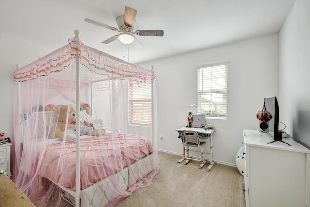 118 Esparza Dr, Bastrop, TX 78602 - bedroom featuring light colored carpet, a desk, and a ceiling fan