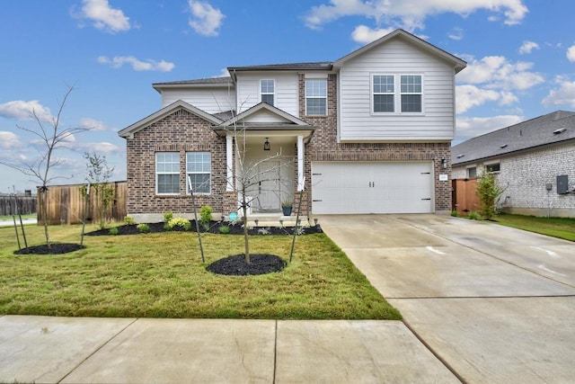 118 Esparza Dr, Bastrop, TX 78602 - traditional-style house featuring brick siding, a garage, and driveway