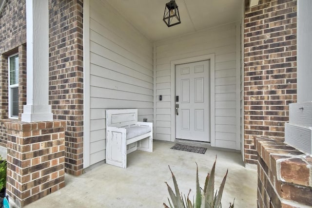 118 Esparza Dr, Bastrop, TX 78602 - view of exterior entry featuring brick siding