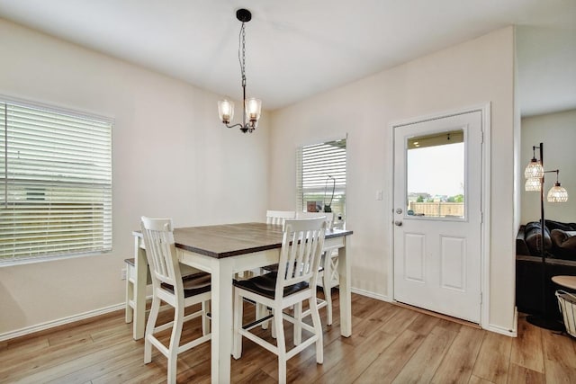 118 Esparza Dr, Bastrop, TX 78602 - dining space featuring light wood-style flooring and a chandelier