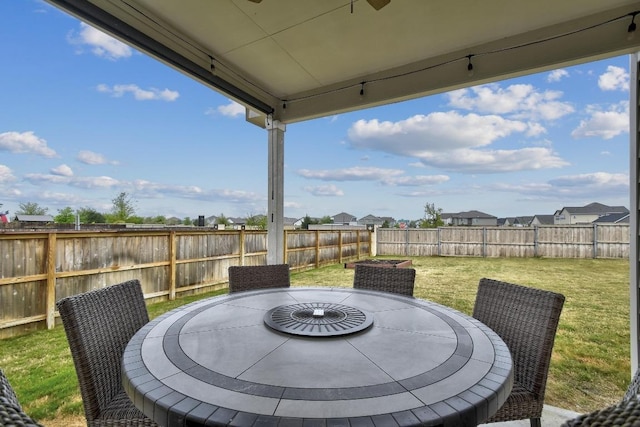 118 Esparza Dr, Bastrop, TX 78602 - fenced backyard with outdoor dining space