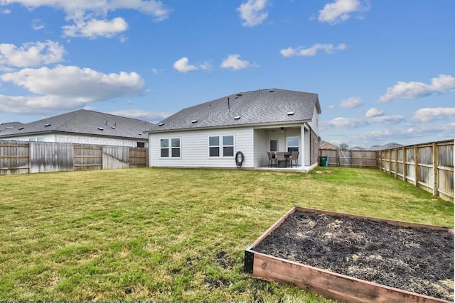 118 Esparza Dr, Bastrop, TX 78602 - rear view of house with a garden, a fenced backyard, and a patio area