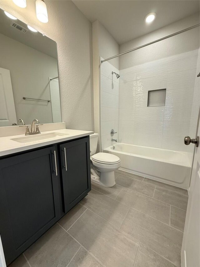 8516 Dongan Dr, Austin, TX 78744 - bathroom featuring shower / tub combination, vanity, tile patterned flooring, and a textured wall