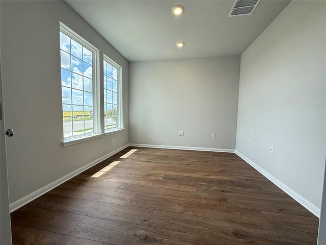 8516 Dongan Dr, Austin, TX 78744 - unfurnished room with dark wood finished floors and recessed lighting