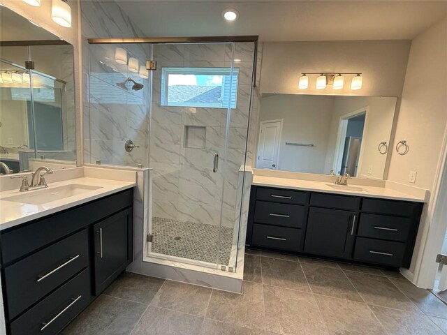 8516 Dongan Dr, Austin, TX 78744 - bathroom featuring two vanities, a marble finish shower, and recessed lighting