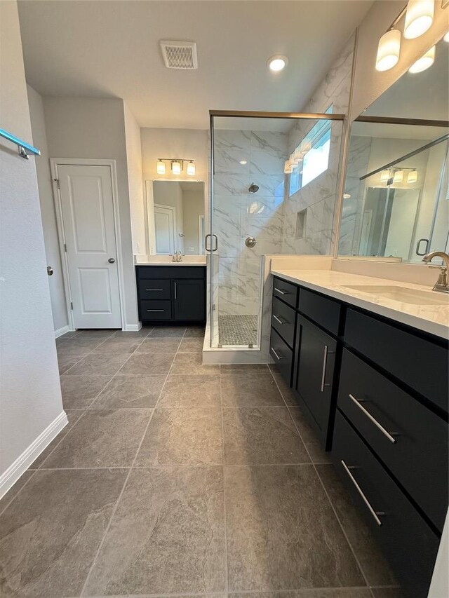 8516 Dongan Dr, Austin, TX 78744 - full bathroom featuring a marble finish shower and two vanities