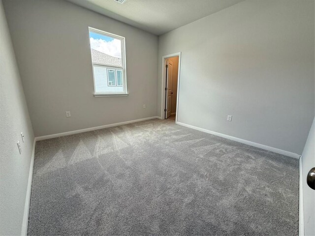 8516 Dongan Dr, Austin, TX 78744 - spare room featuring carpet floors and baseboards