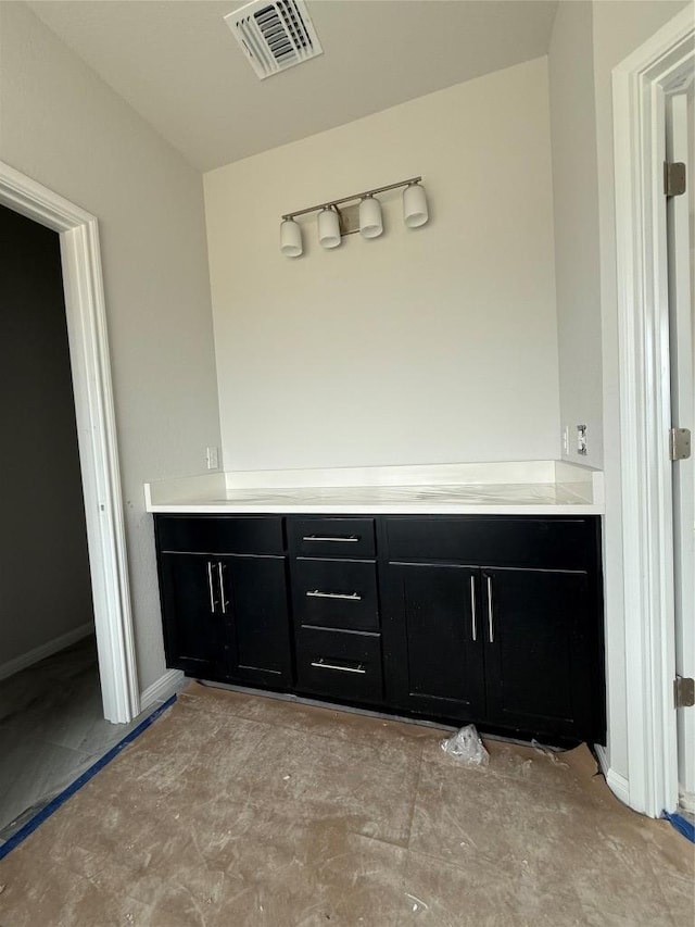 8600 Dongan Dr, Austin, TX 78744 - bathroom with baseboards and visible vents