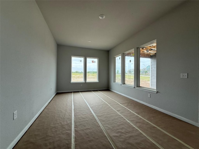 8600 Dongan Dr, Austin, TX 78744 - carpeted empty room featuring baseboards