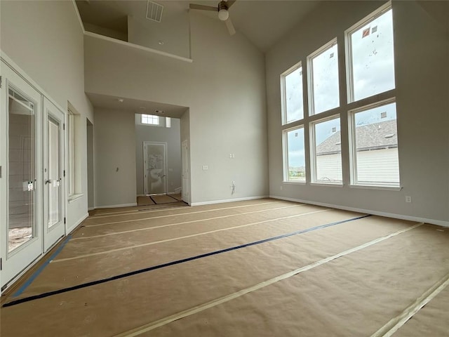8600 Dongan Dr, Austin, TX 78744 - interior space with ceiling fan, high vaulted ceiling, visible vents, and baseboards