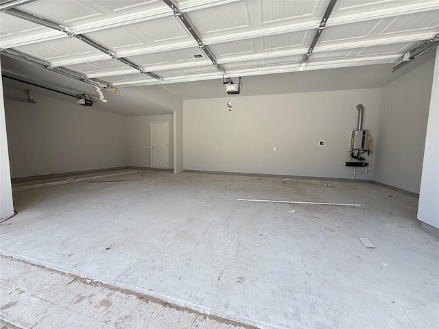 8600 Dongan Dr, Austin, TX 78744 - garage with a garage door opener and water heater