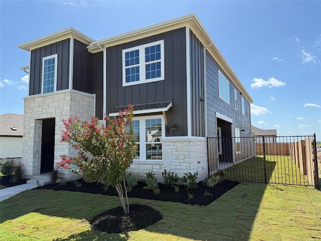 8600 Dongan Dr, Austin, TX 78744 - view of front of house with board and batten siding and stone siding
