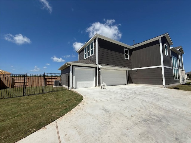 8600 Dongan Dr, Austin, TX 78744 - view of property exterior with a garage and concrete driveway