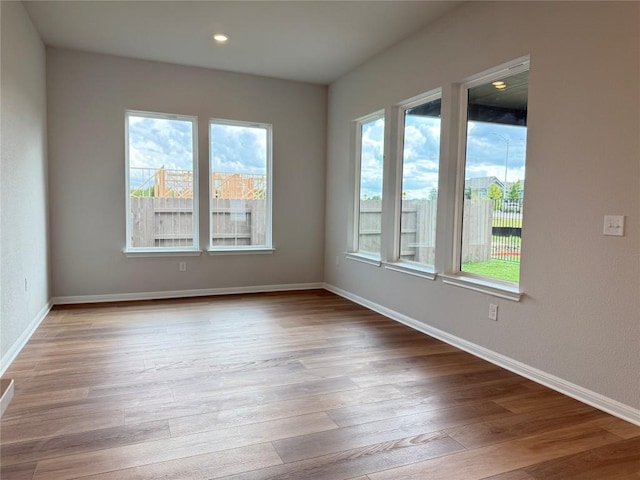 8600 Dongan Dr, Austin, TX 78744 - unfurnished room featuring wood finished floors and recessed lighting