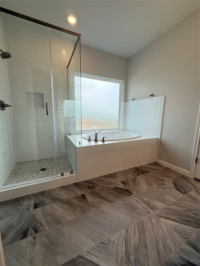 8600 Dongan Dr, Austin, TX 78744 - full bath featuring a garden tub and a stall shower