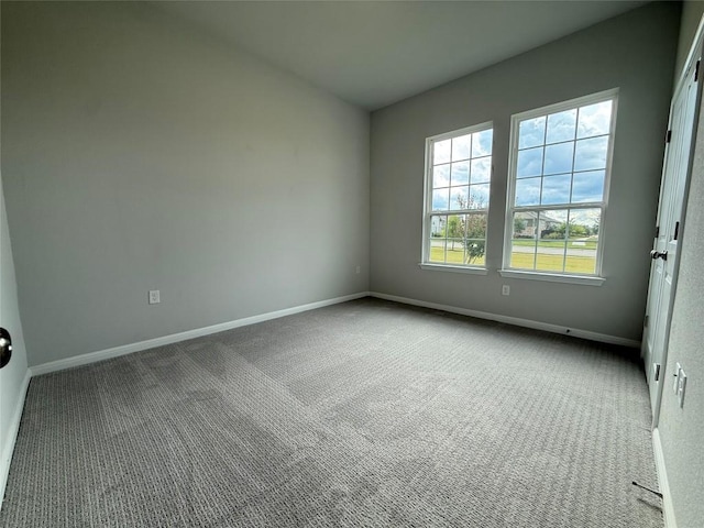 8600 Dongan Dr, Austin, TX 78744 - carpeted empty room with baseboards