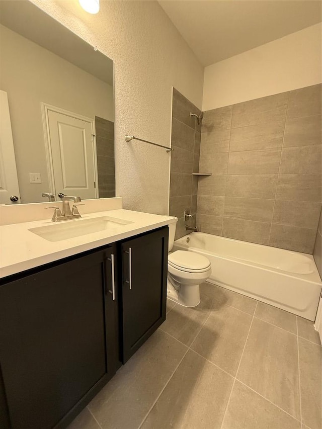 8600 Dongan Dr, Austin, TX 78744 - full bath featuring tile patterned flooring, vanity, shower / washtub combination, and a textured wall