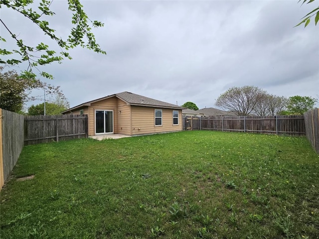 2414 Blue Sky Ln, Lockhart, TX 78644 - back of property with a fenced backyard and a yard