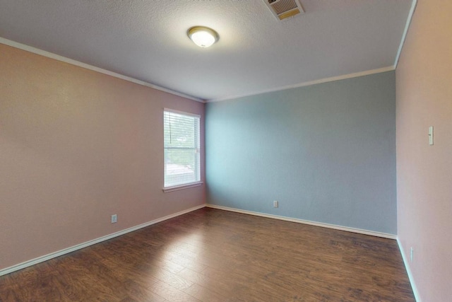 1711 Lloydminister Way, Cedar Park, TX 78613 - unfurnished room featuring crown molding, dark wood finished floors, baseboards, and a textured ceiling