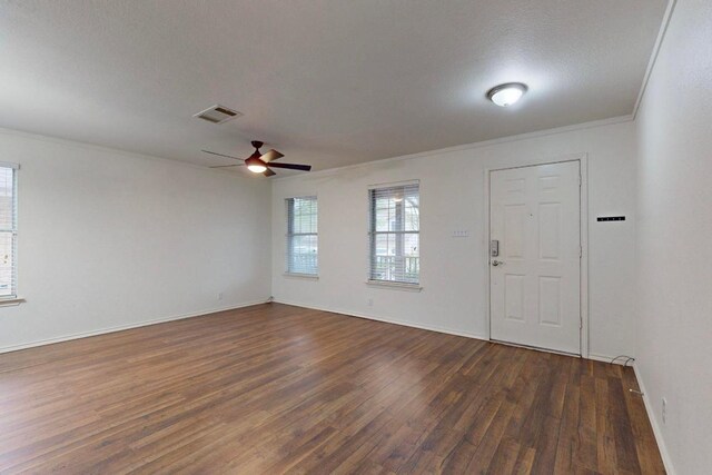 1711 Lloydminister Way, Cedar Park, TX 78613 - foyer entrance featuring dark wood-style flooring, crown molding, a ceiling fan, and baseboards