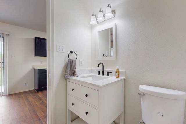 1711 Lloydminister Way, Cedar Park, TX 78613 - bathroom with vanity, wood finished floors, and toilet