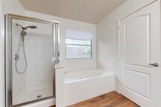 1711 Lloydminister Way, Cedar Park, TX 78613 - bathroom with a shower stall, a bath, and wood finished floors