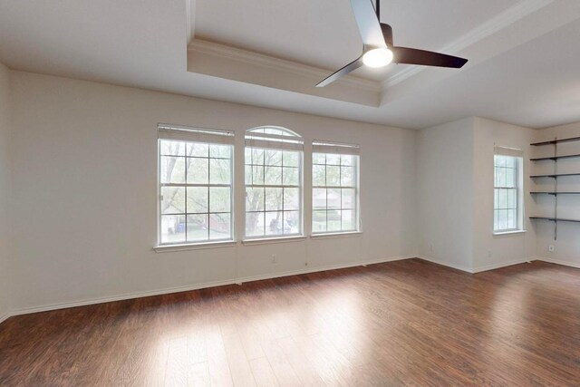 1711 Lloydminister Way, Cedar Park, TX 78613 - unfurnished room featuring crown molding, a tray ceiling, a ceiling fan, dark wood finished floors, and baseboards
