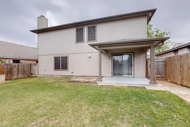 1711 Lloydminister Way, Cedar Park, TX 78613 - rear view of property with a patio and a chimney