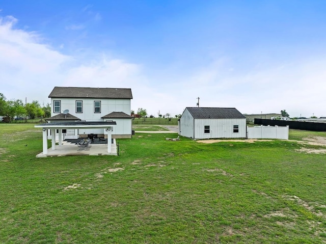 150 Huntclub Dr, Jarrell, TX 76537 - rear view of house featuring a patio area, a pole building, and an outdoor structure
