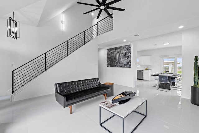 150 Huntclub Dr, Jarrell, TX 76537 - tiled living room with stairway, recessed lighting, a ceiling fan, a chandelier, and baseboards