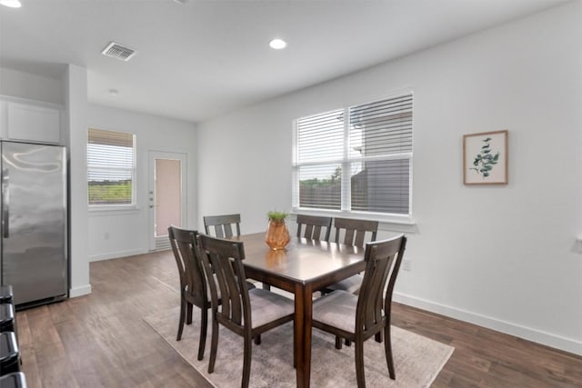 13609 Baileyfield Dr, Pflugerville, TX 78660 - dining space featuring baseboards, wood finished floors, and recessed lighting