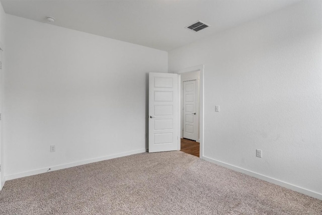 13609 Baileyfield Dr, Pflugerville, TX 78660 - unfurnished room featuring carpet, baseboards, and a smoke detector