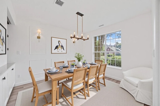 3505 Galena Hills Loop, Round Rock, TX 78681 - dining space featuring light wood finished floors and a chandelier