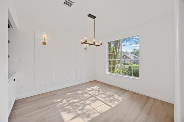 3505 Galena Hills Loop, Round Rock, TX 78681 - unfurnished dining area featuring a chandelier and light wood-style floors
