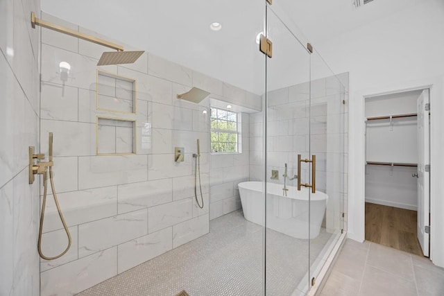 3505 Galena Hills Loop, Round Rock, TX 78681 - bathroom featuring a tile shower, a freestanding bath, and a walk in closet