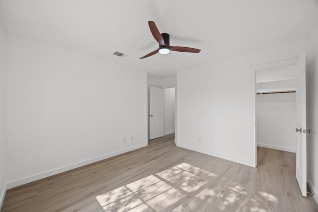 3505 Galena Hills Loop, Round Rock, TX 78681 - unfurnished bedroom with wood finished floors, a walk in closet, a closet, and a ceiling fan