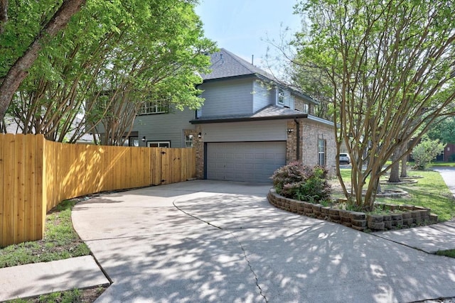 3505 Galena Hills Loop, Round Rock, TX 78681 - view of side of property with brick siding, driveway, and a garage