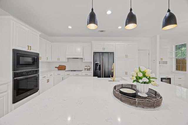 3505 Galena Hills Loop, Round Rock, TX 78681 - kitchen with black appliances, decorative light fixtures, white cabinetry, light stone countertops, and recessed lighting