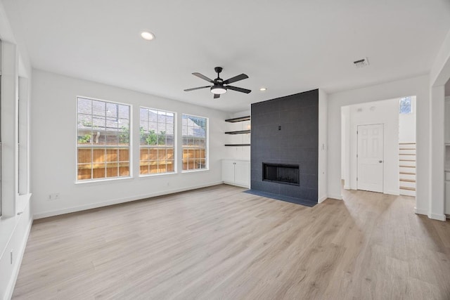 3505 Galena Hills Loop, Round Rock, TX 78681 - unfurnished living room with recessed lighting, a ceiling fan, light wood finished floors, and a fireplace