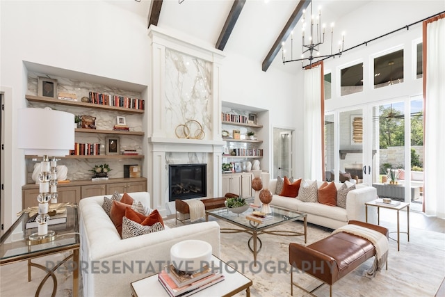 living area with a premium fireplace, wood finished floors, beamed ceiling, and a towering ceiling