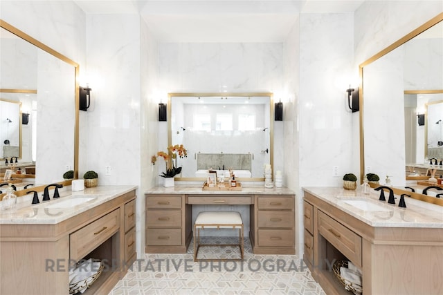 full bath featuring two vanities and a sink